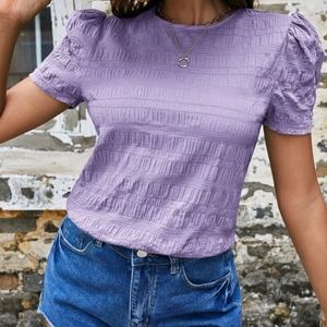 Cute top with puffed sleeves. Size M